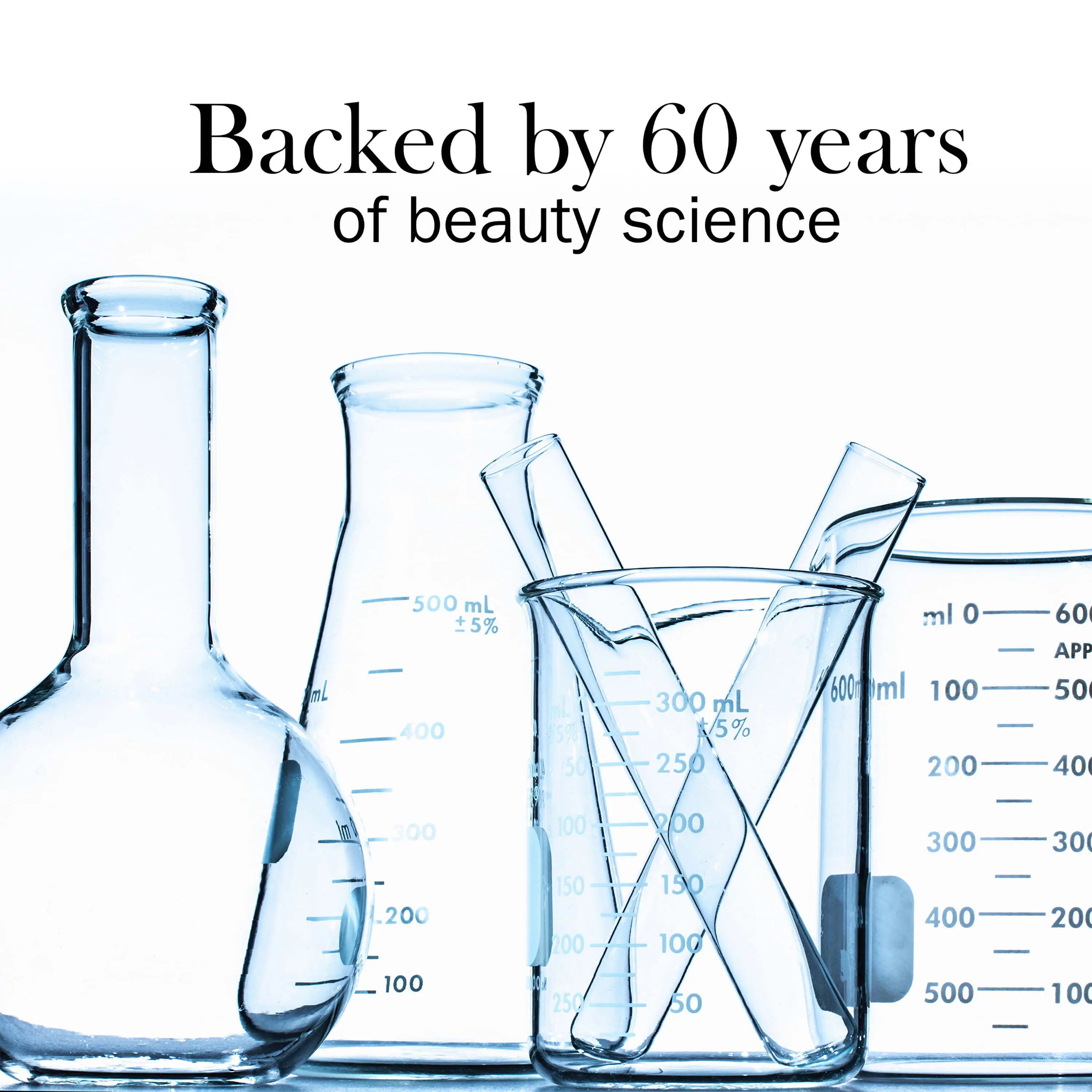 Olay body wash bottle displayed next to Vitamin E capsules and moisturizing ingredients