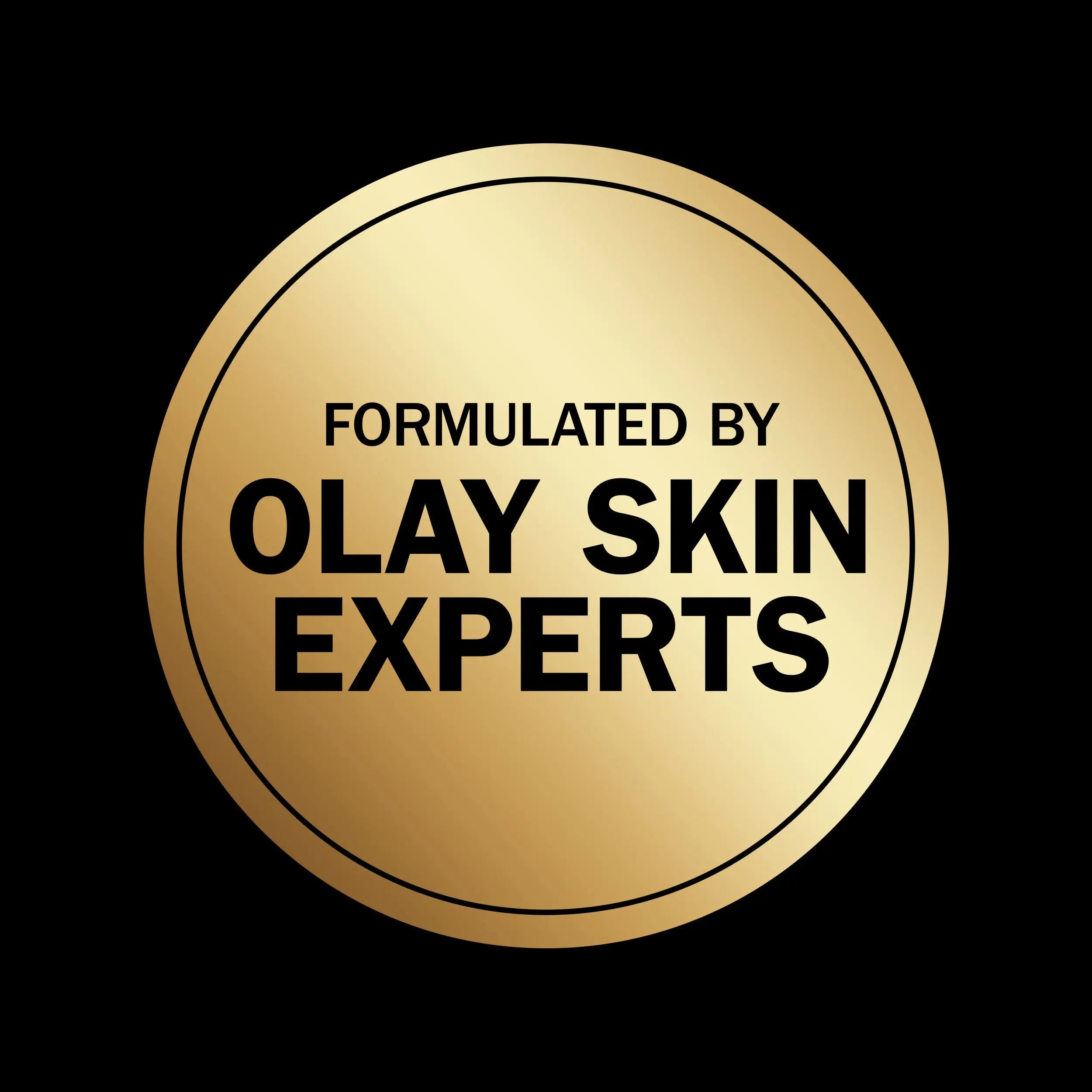 Rich lather of Olay Age Defying Body Wash on a pouf in a shower setting